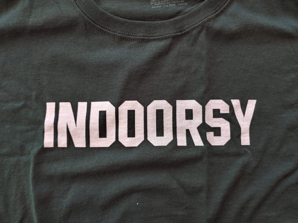 A picture of a t-shirt with the word "Indoorsy" on it